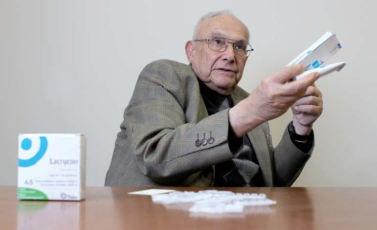Professor holding a drug
